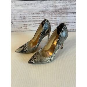 Ted Baker
Izibely stiletto pumps python print. Size 38.5 /  8 1/2